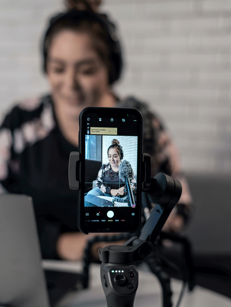 woman creating content using an iphone