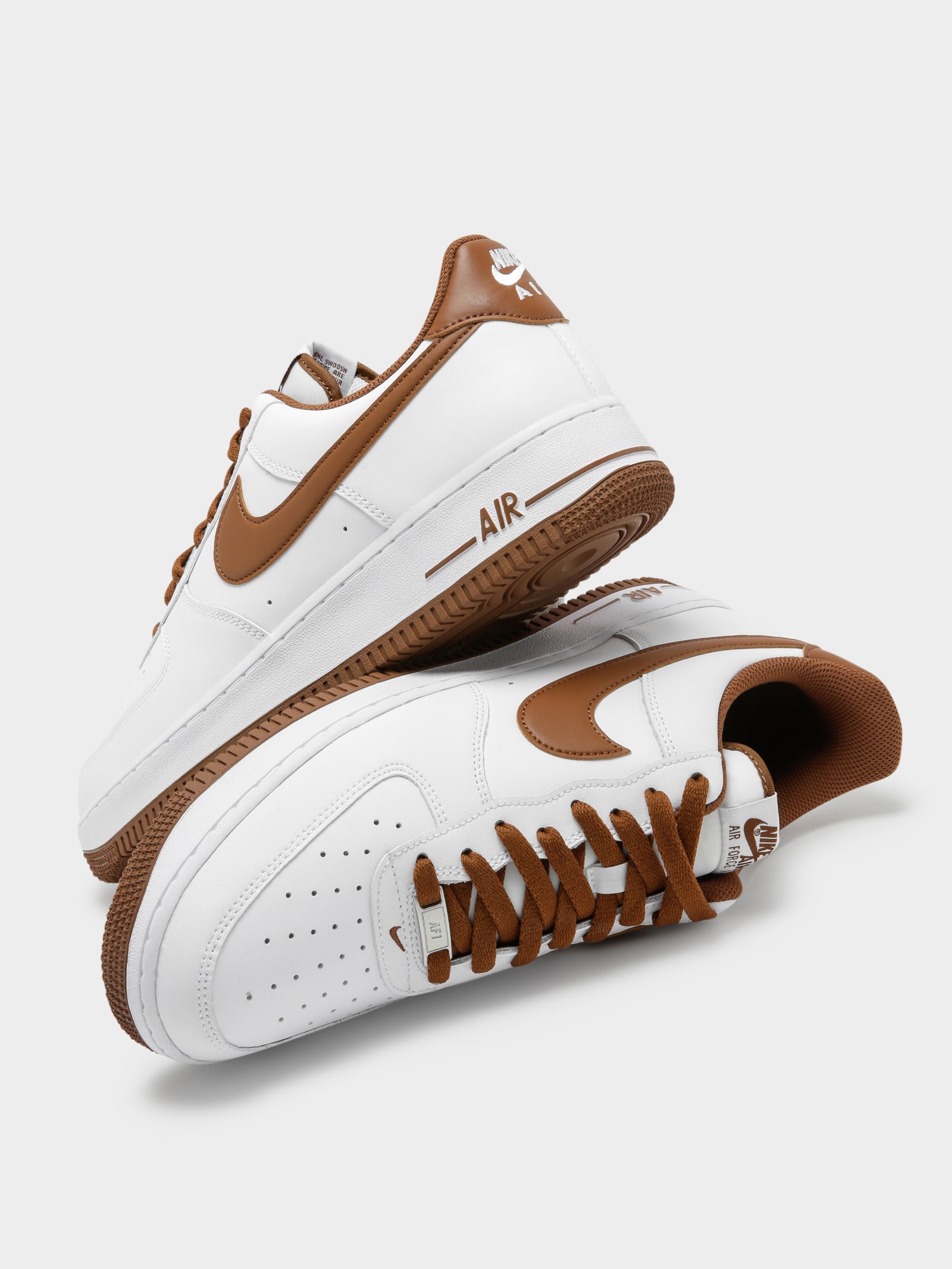 white and brown air force ones