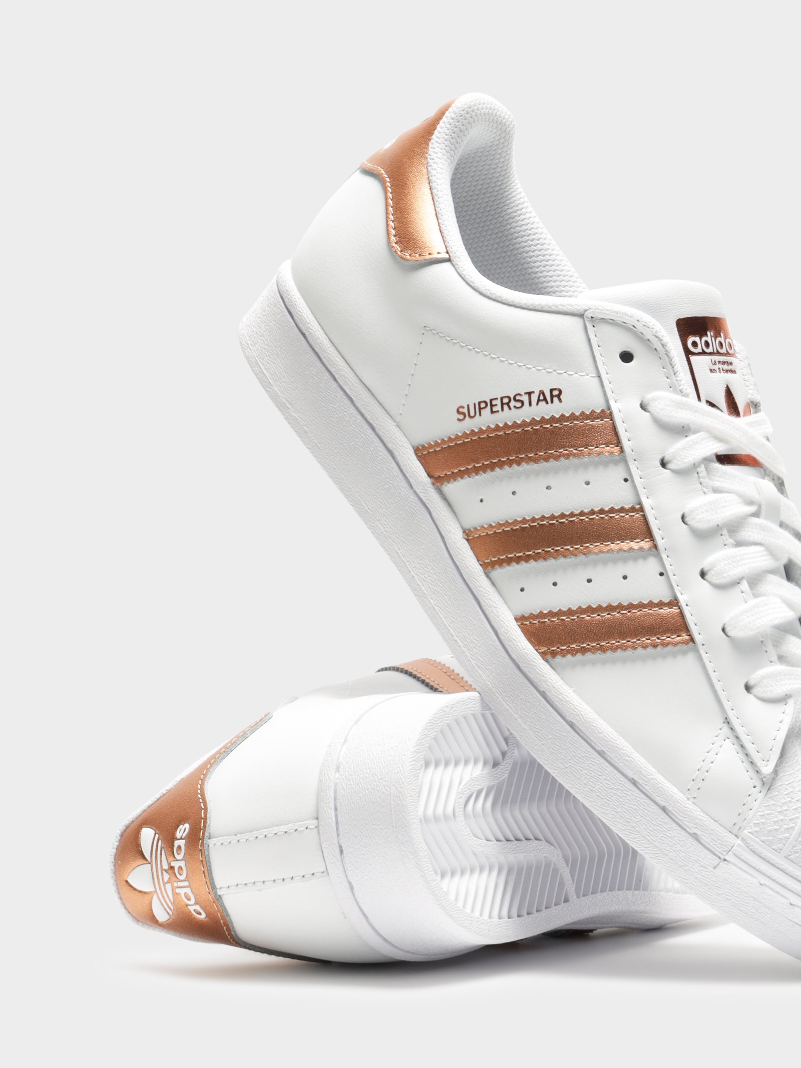 women's white and rose gold adidas