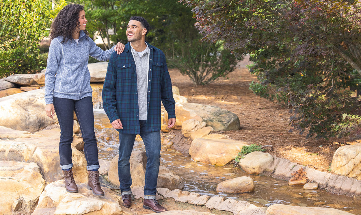 Women and man at creek in the fall