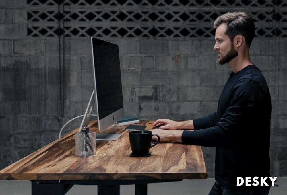 Man working in comfort with a standing desk