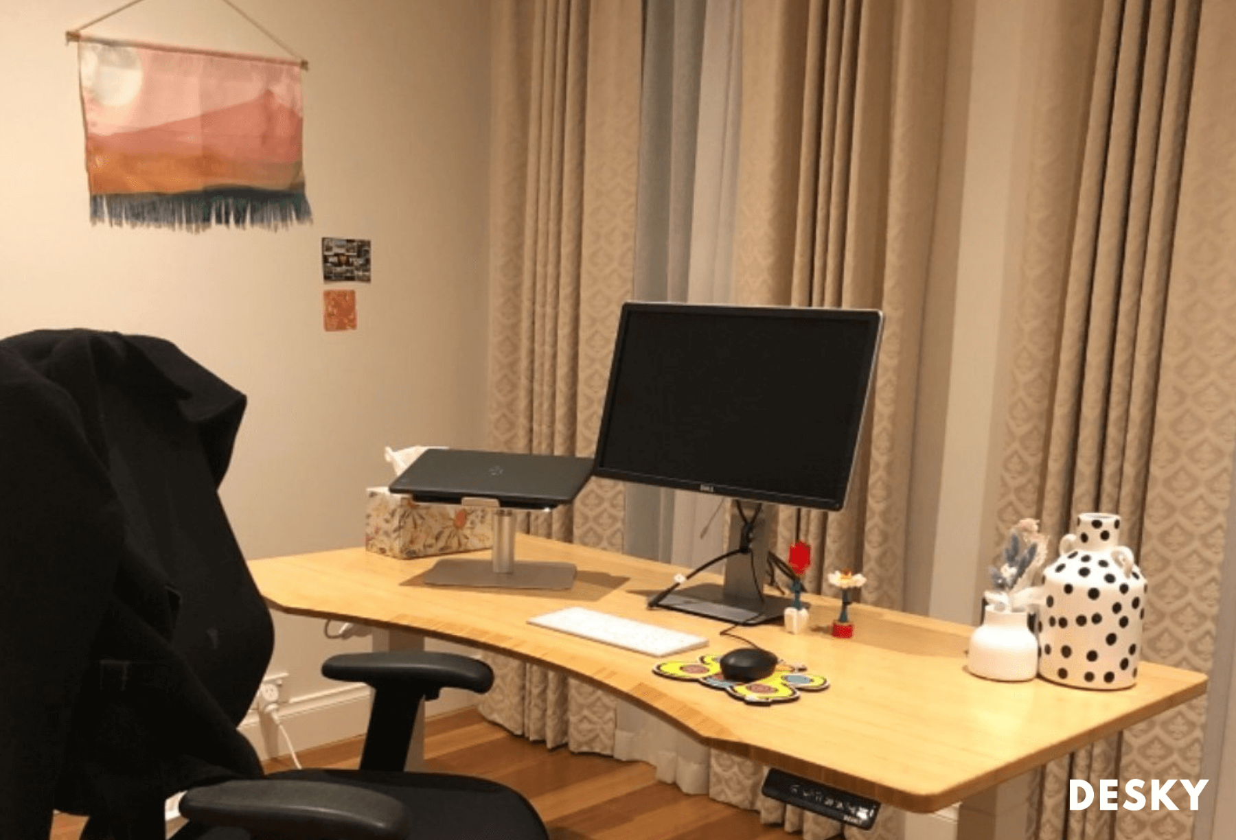 electric adjustable sit-stand desk in a home office