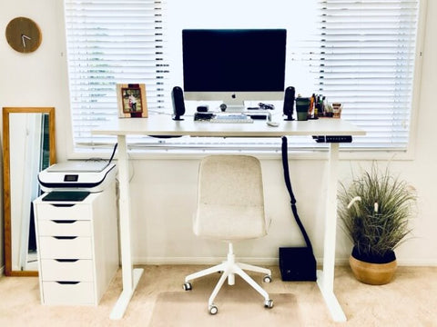 white sit and stand desk with chair