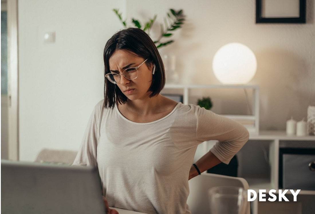 woman sitting with back pain