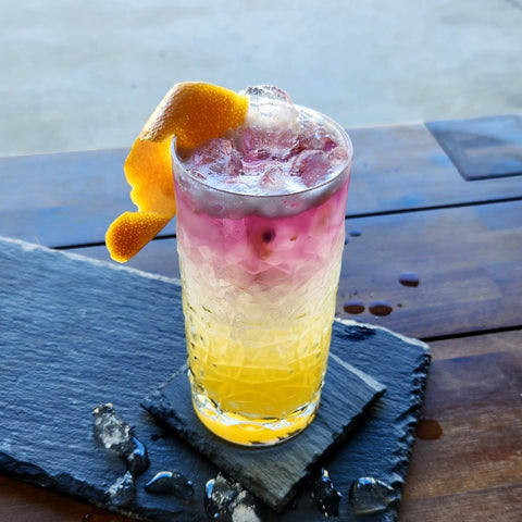 Newy Distillery Purple Pineapple and Passionfruit Gin Collins cocktail.