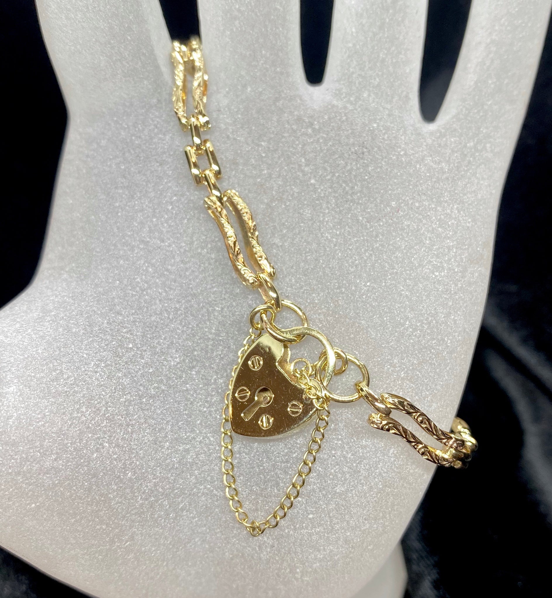 gold bracelet with heart locket