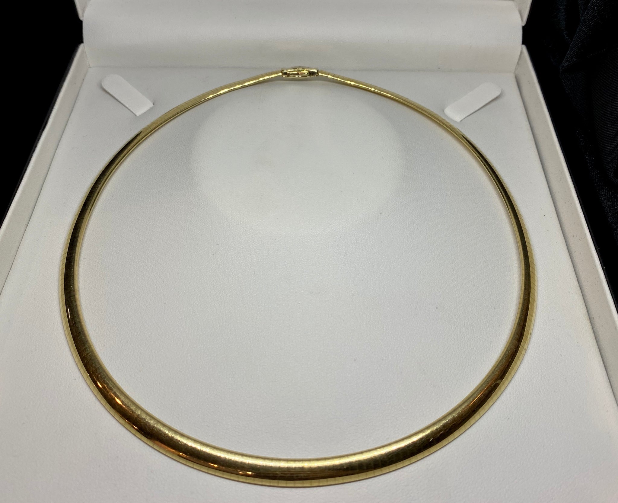 gold omega pendant