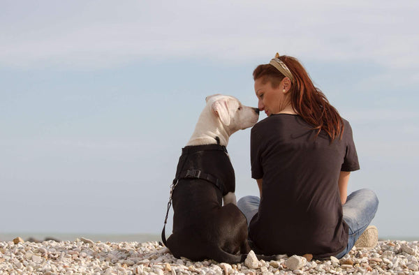 lady smooching with her dog