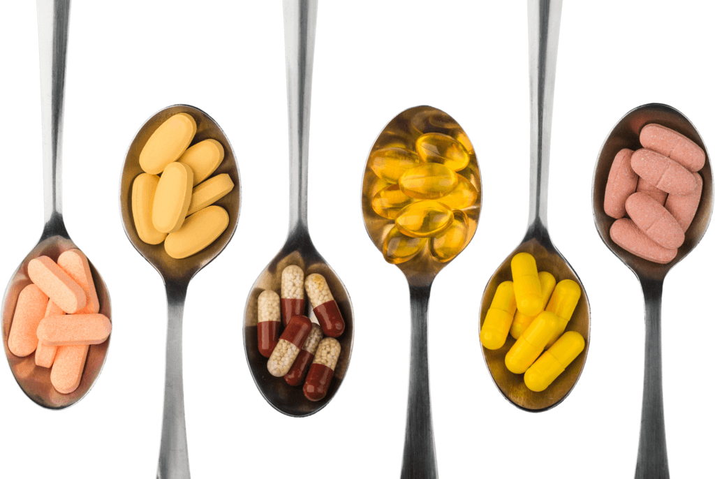 variety of vitamins and minerals on spoons