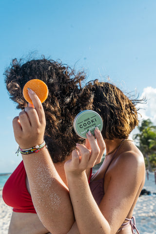 Eco-Friendly Shampoo Bars Held Pp by Two Girls on the Beach 