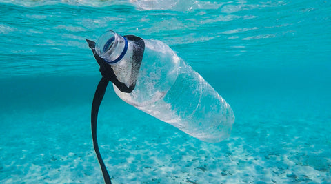 Plastic bottles floating in the ocean. The effects on plastic pollution. 