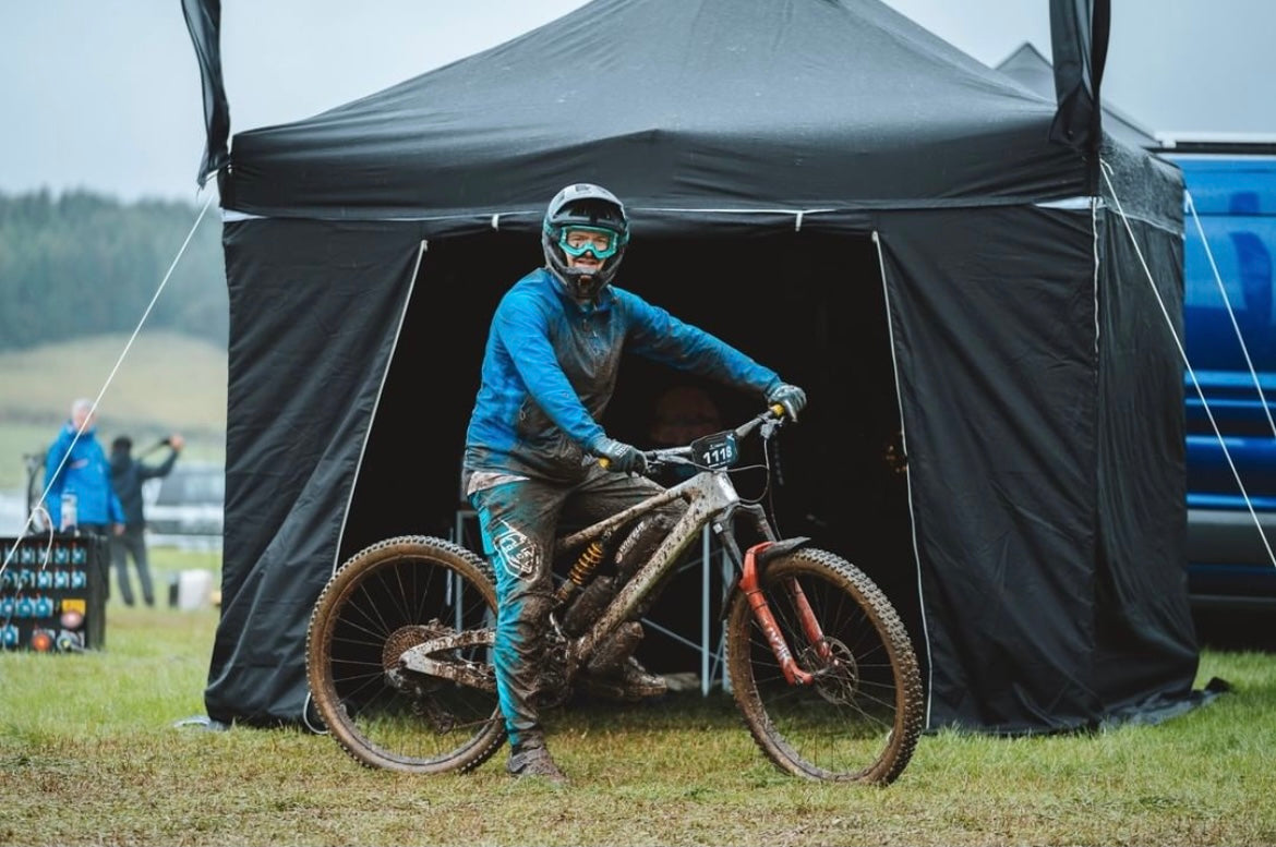 Michael maiden at Enduro World Series Pole factory racing tent wheelie bike shop