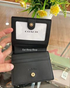 coach small wallet signature