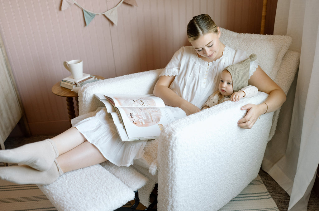 mother and toddler sitting in Flynn nursery recliner