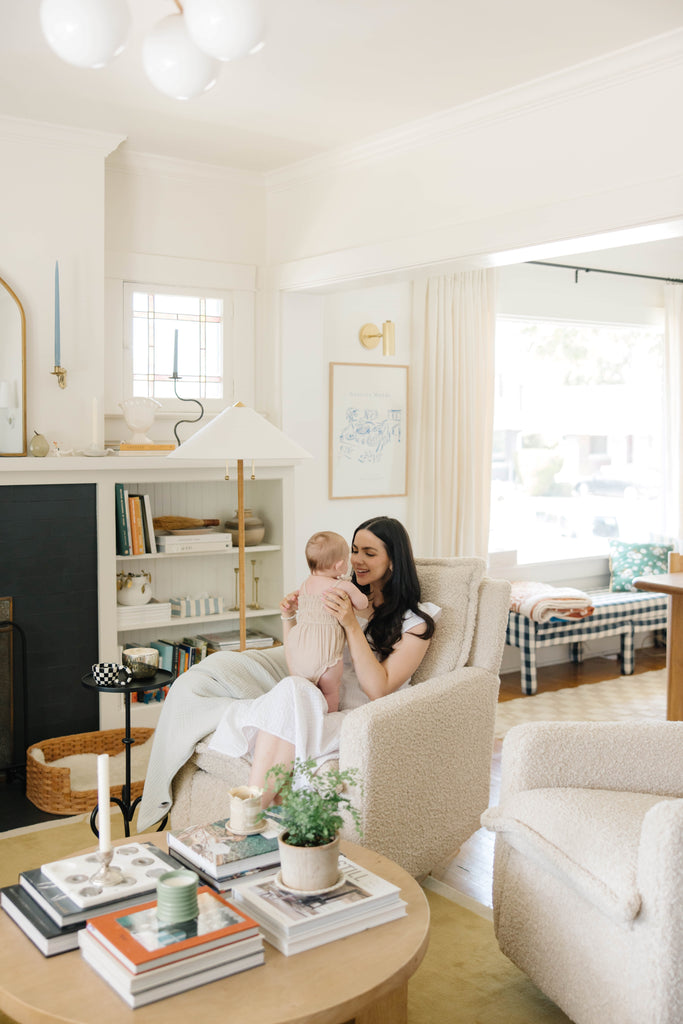 woman and baby in recliner in eclectic style living room