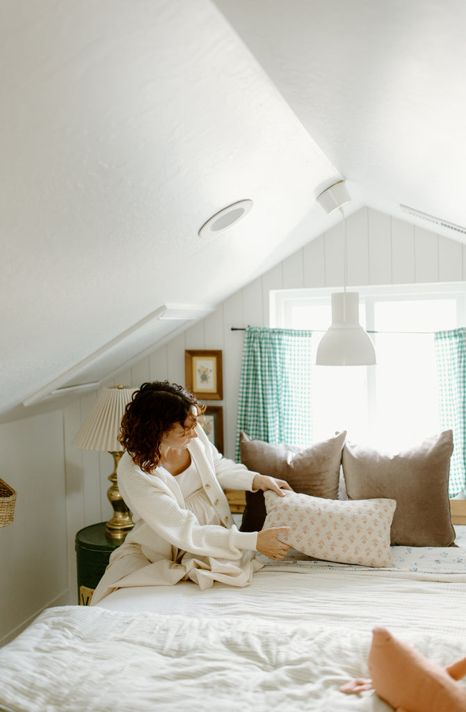 woman in vintage inspired bedroom