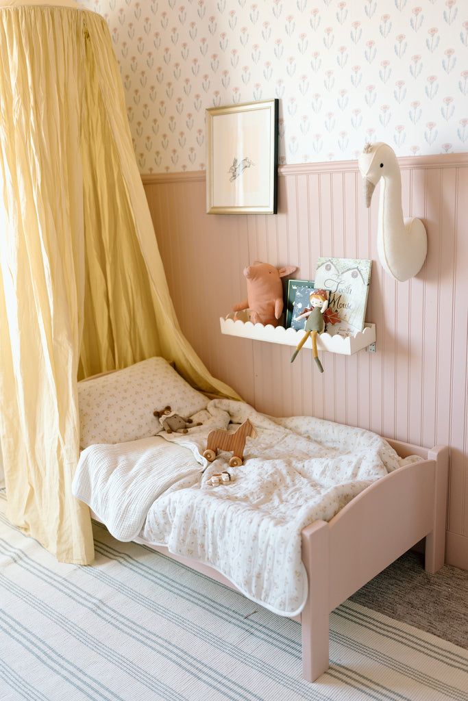 toddler bed with canopy in dusty rose nursery