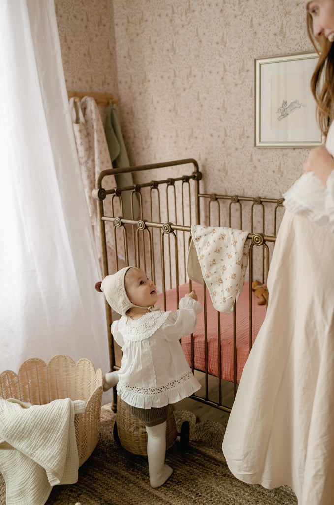 oilo nursery with muslin crib sheet in crib