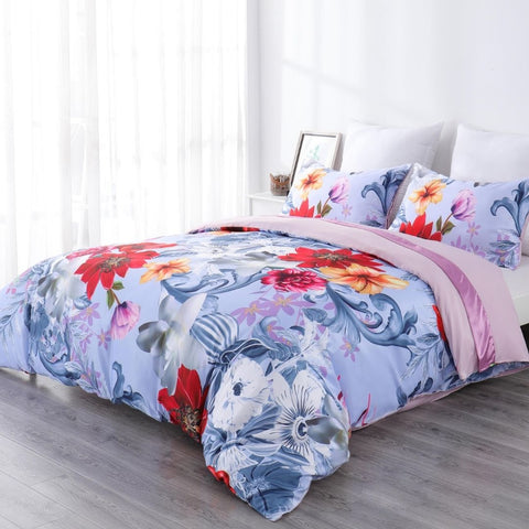 A comfy bedroom with floral comforter.