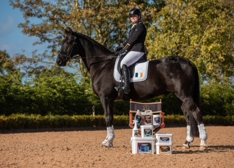 katie reilly with products on horse
