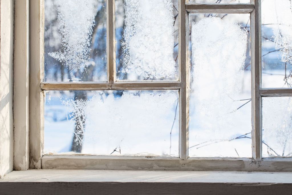 An old and steamy window