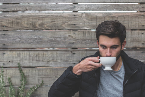 Man sipping a cup of tea