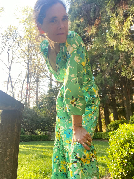 Ann in her backyard in the green version of our floral printed charmeuse Aba dress.