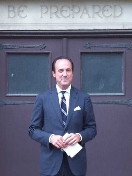 Sid wearing an Air Force Blue suit in front of a church door