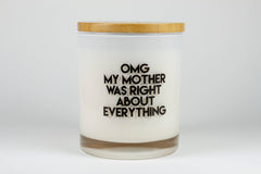Glass candle with 'OMG my mother was right about everything' printed in black on the exterior.