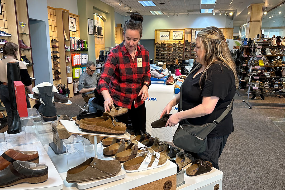 Woman getting foorwear recommendations at Shoe Mill