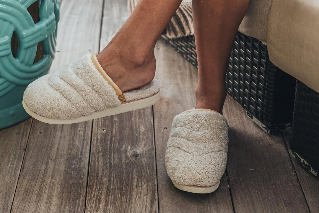 Woman wearing white slippers