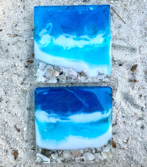 Two pieces of beach-themed resin art made with epoxy resin, natural seashells, plus blue and white Pigmently Mica Powders.