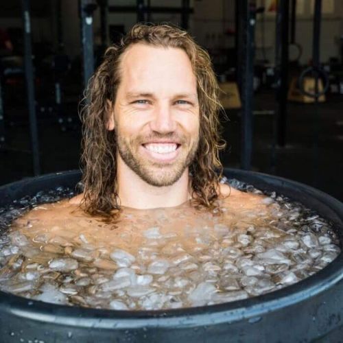 A man inside the Ice Barrel smiling