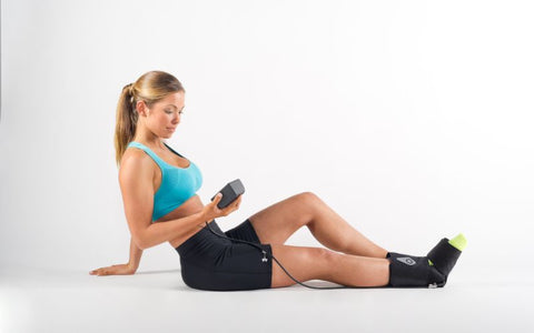 Woman on the floor using the Squid Go Ankle system