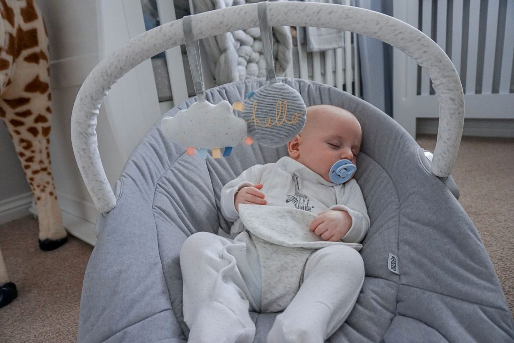 Baby Theo asleep in the Apollo cradle.