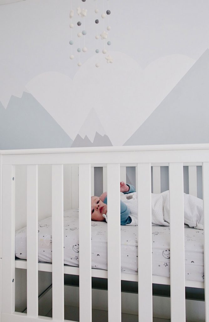 Another image of baby Gabriel in the cot bed.