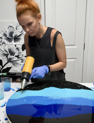 Using heat gun to create wave patterns in epoxy resin art