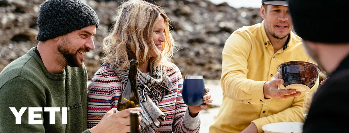 drinking from a navy YETI wine tumbler