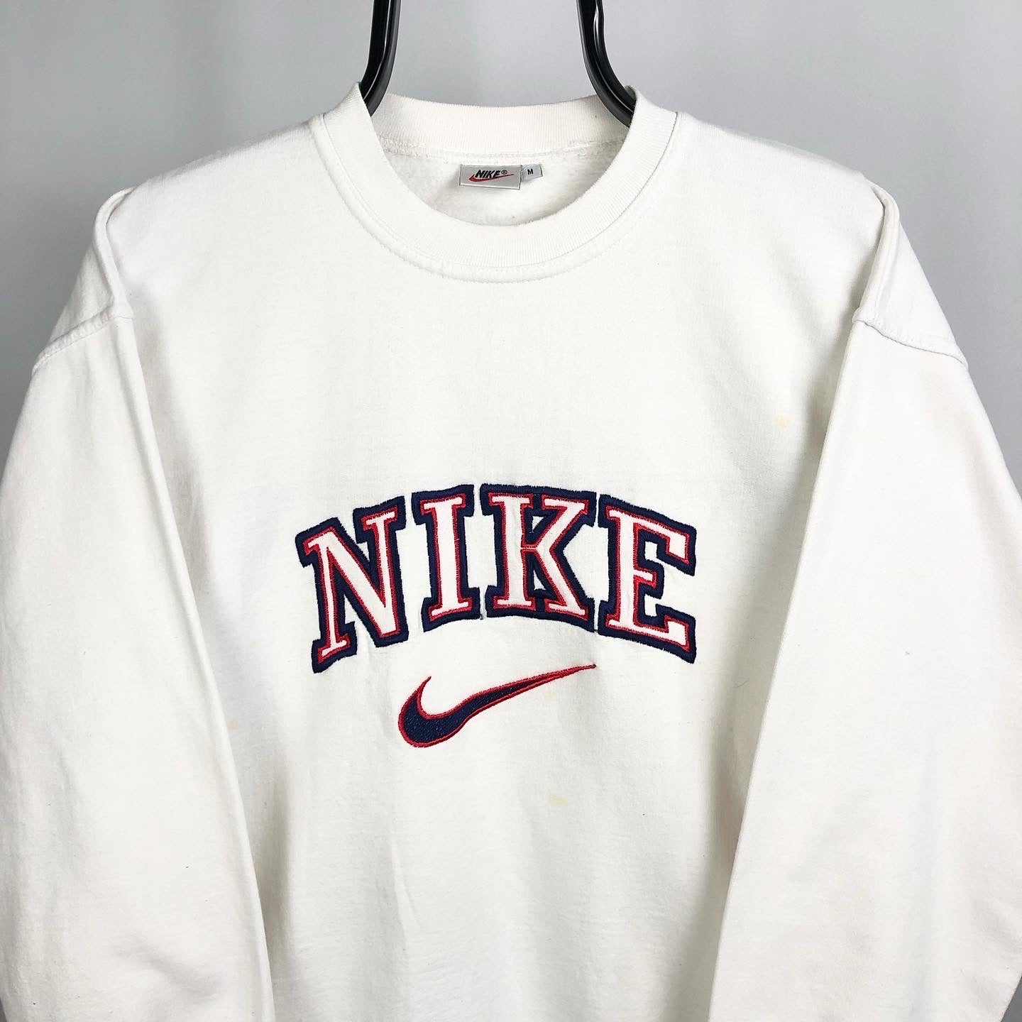 white nike spellout sweatshirt