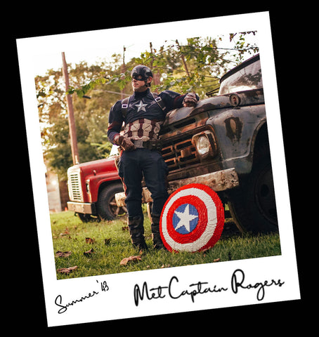 Cap cosplayer standing beside Cap's Shield made of LEGO® bricks