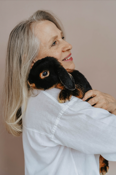 Mature Woman Holding Animal Bunny Cruelty-Free Makeup