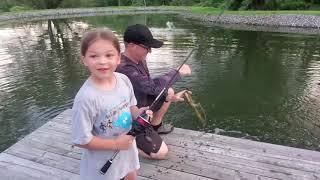 Kids fishing with KastKing spincast reel on a pond dock for bluegills