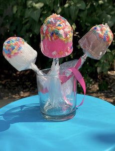 a glass vase with vanilla, chocolate, and strawberry with sprinkles cake pop soaps