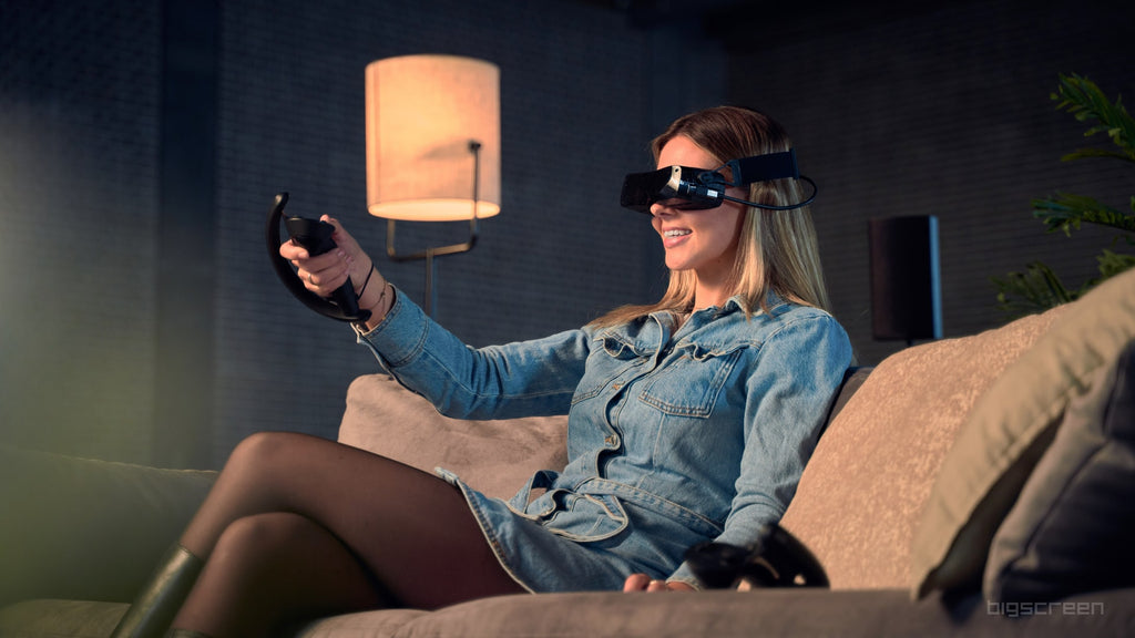 woman wearing bigscreen beyond headset with valve index controllers