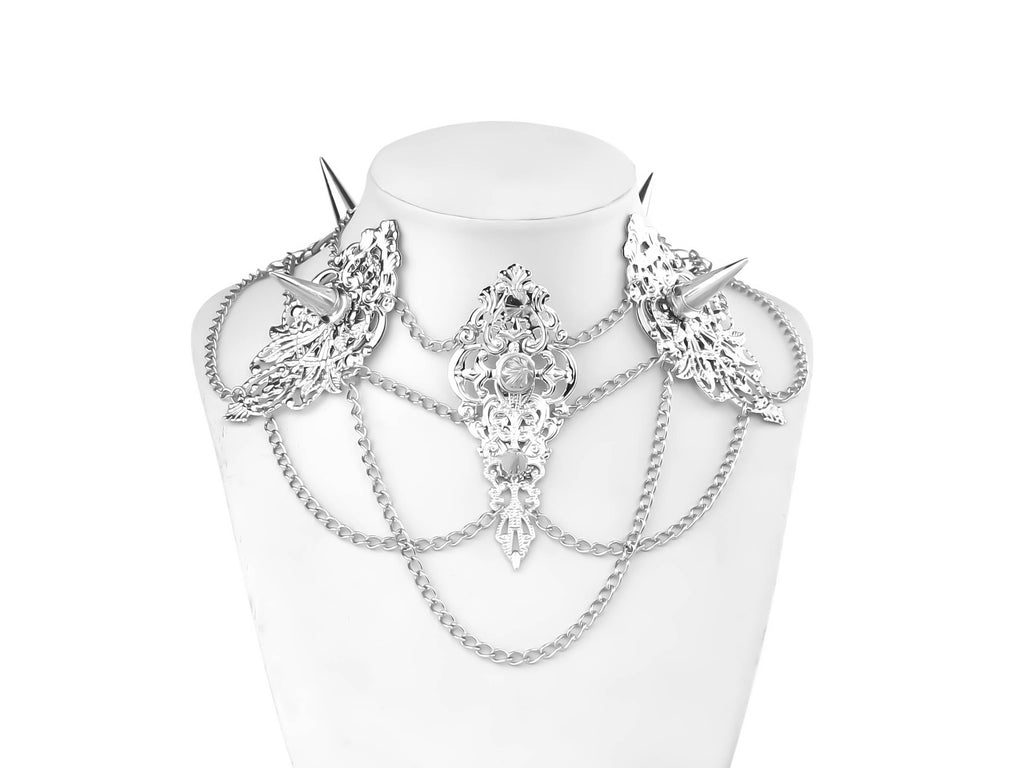 Striking Myril Jewels punk studded metal choker featuring elaborate filigree and cascading chains, exemplifying dark-avantgarde fashion for a gothic-chic statement.
