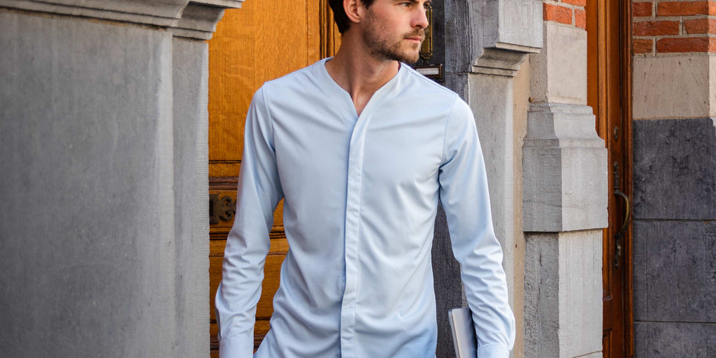 Business man wearing the Cheegs 2.0 Collarless Dress Shirt in Light Blue