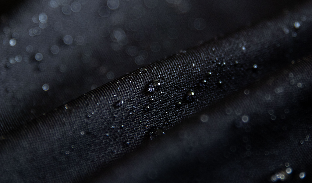 A close up of Cheegs Unique Fabric that is water repelling, heat regulating, wrinkle resistant and offers a 4-way stretch
