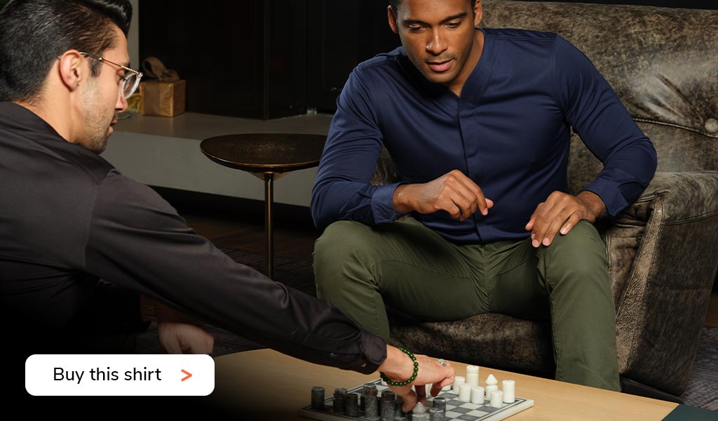 Business Man Playing Chess Wearing a Cheegs 2.0 Collarless Dress Shirt in Navy