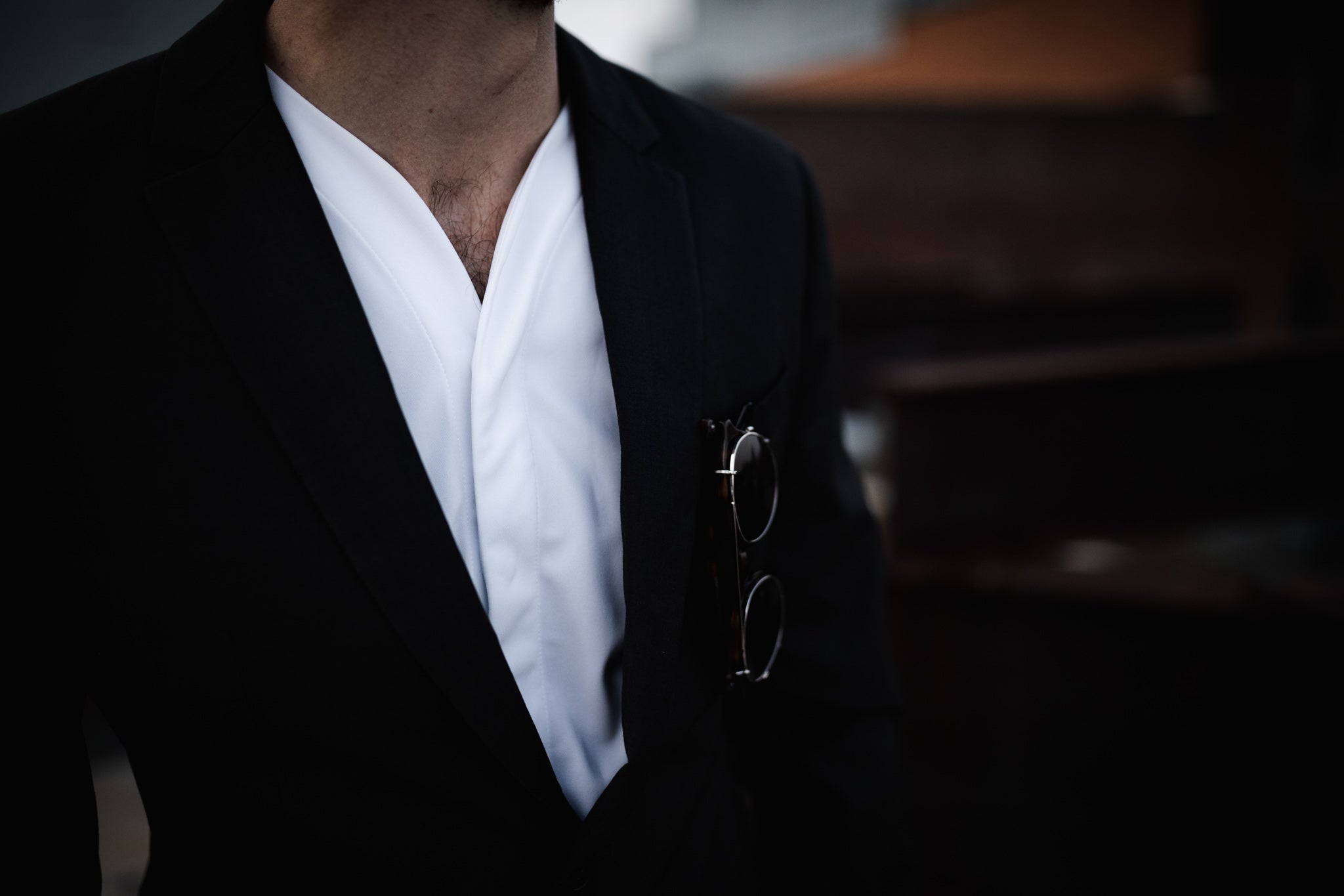 collarless shirt worn with a suit
