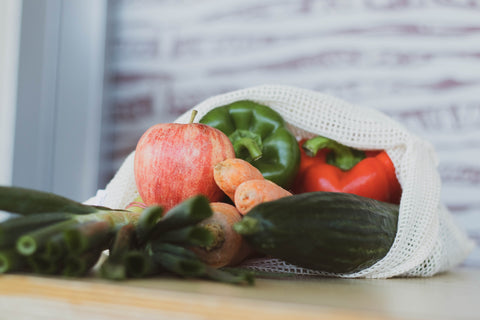 A bag of freshly sourced local produce including vegetables and fruits